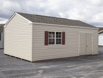 14x24 Peak Style Storage Shed with vinyl siding, a double door, four windows, and a loft built inside