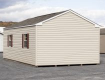14x24 Peak Style Storage Shed with vinyl siding, a double door, four windows, and a loft built inside (Back View)