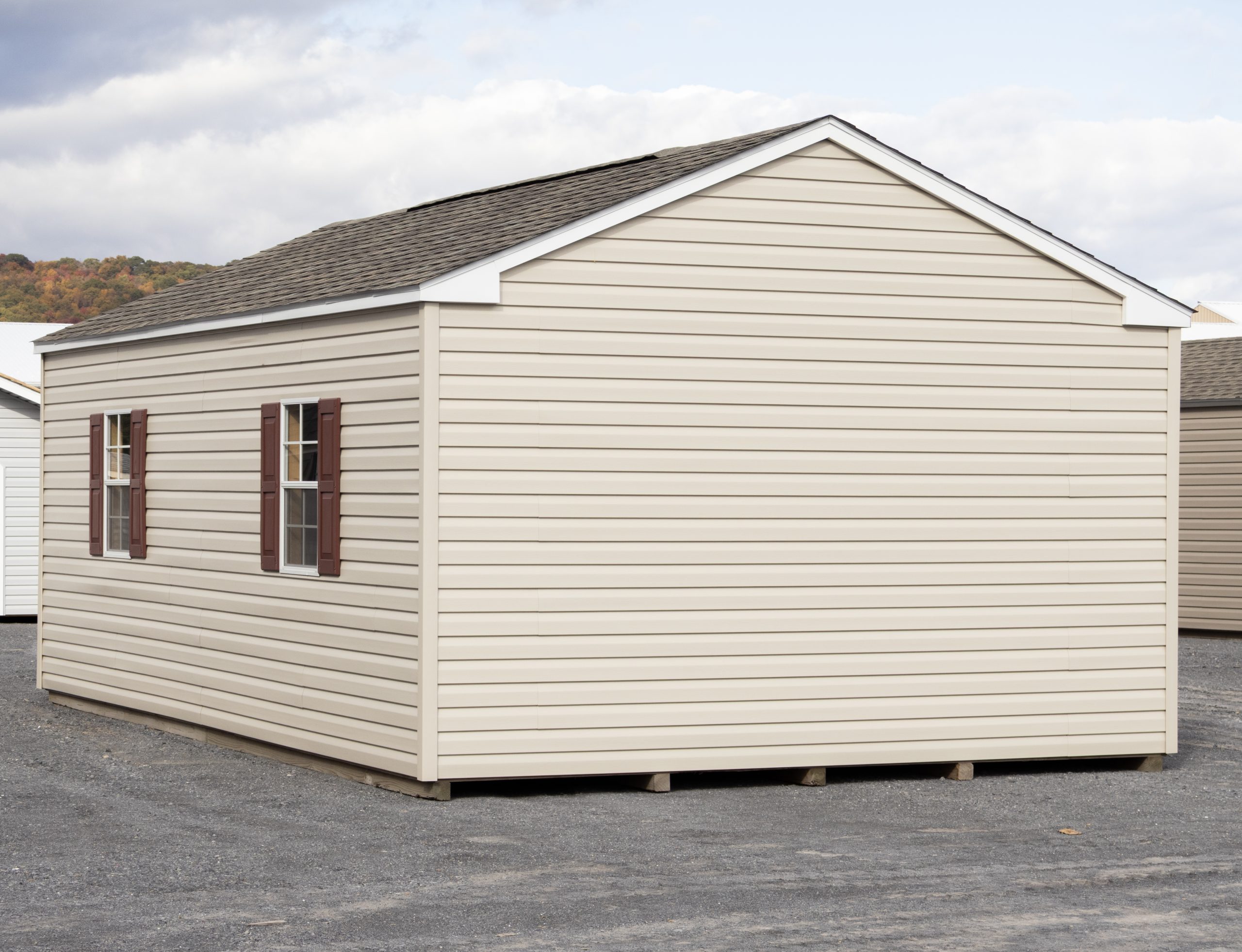 14x24 Peak Style Storage Shed with vinyl siding, a double door, four windows, and a loft built inside (Back View)