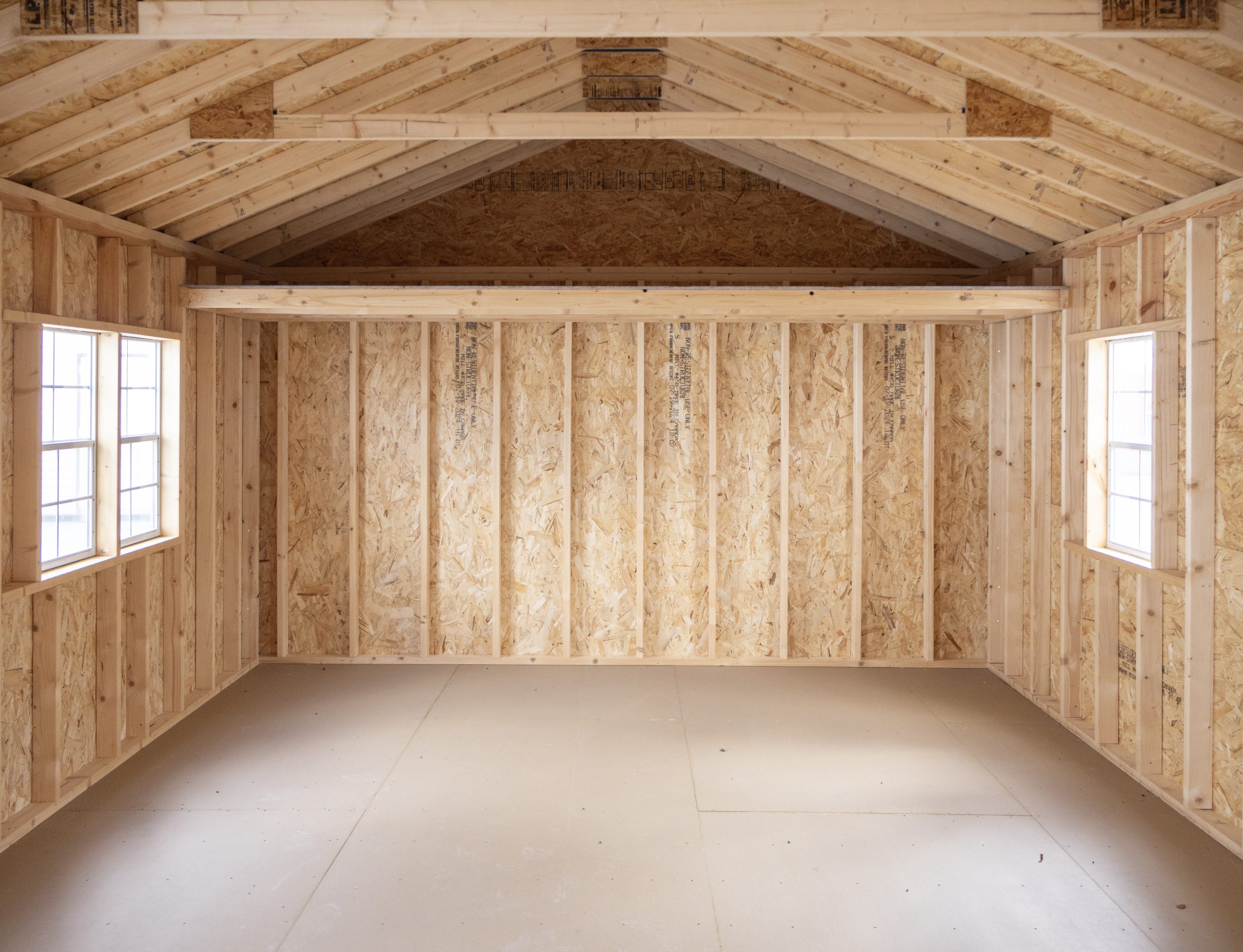 14x24 Peak Style Storage Shed with vinyl siding, a double door, four windows, and a loft built inside (Interior View Of Loft)