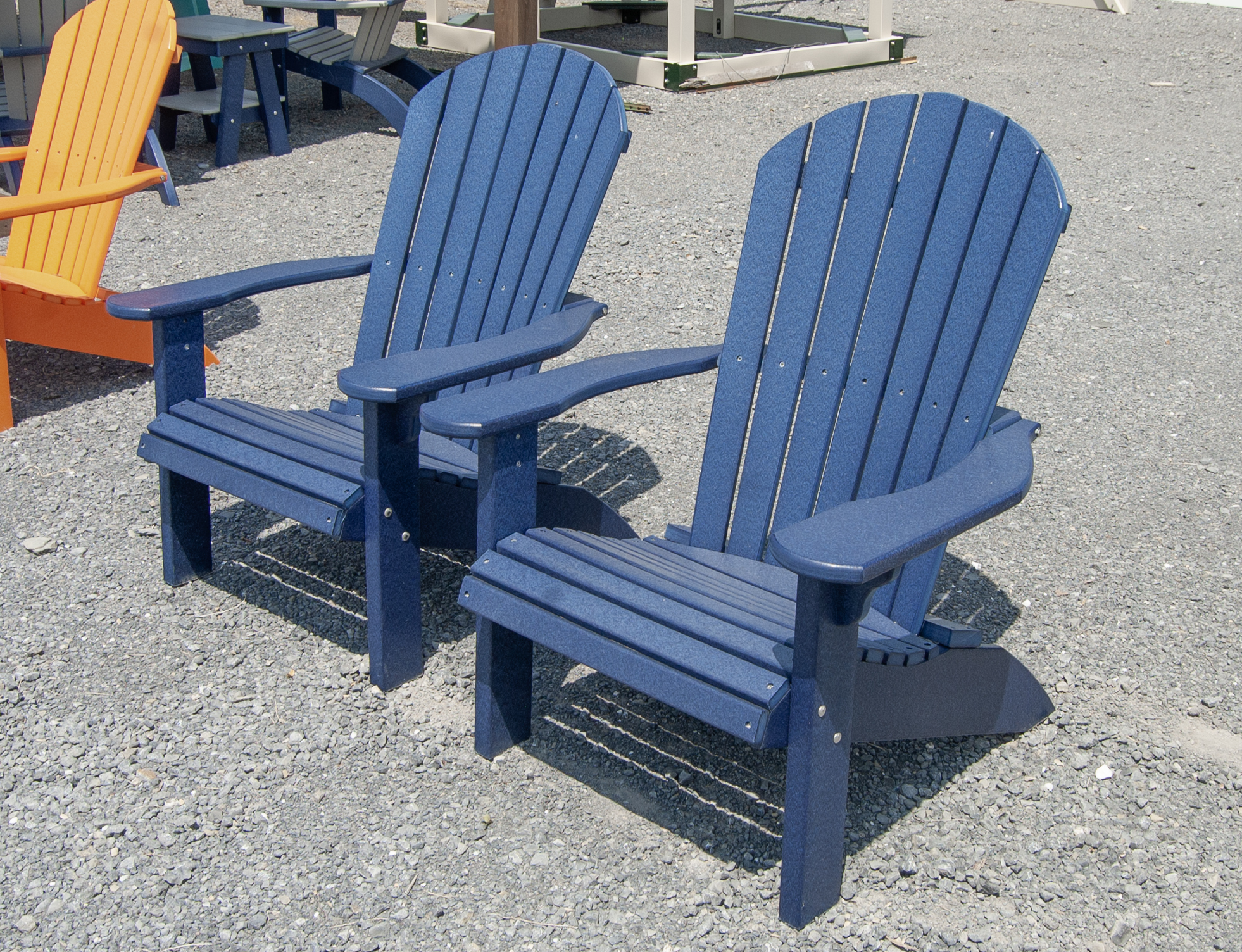 Two Patriot Blue Poly Lumber Adirondack Chairs