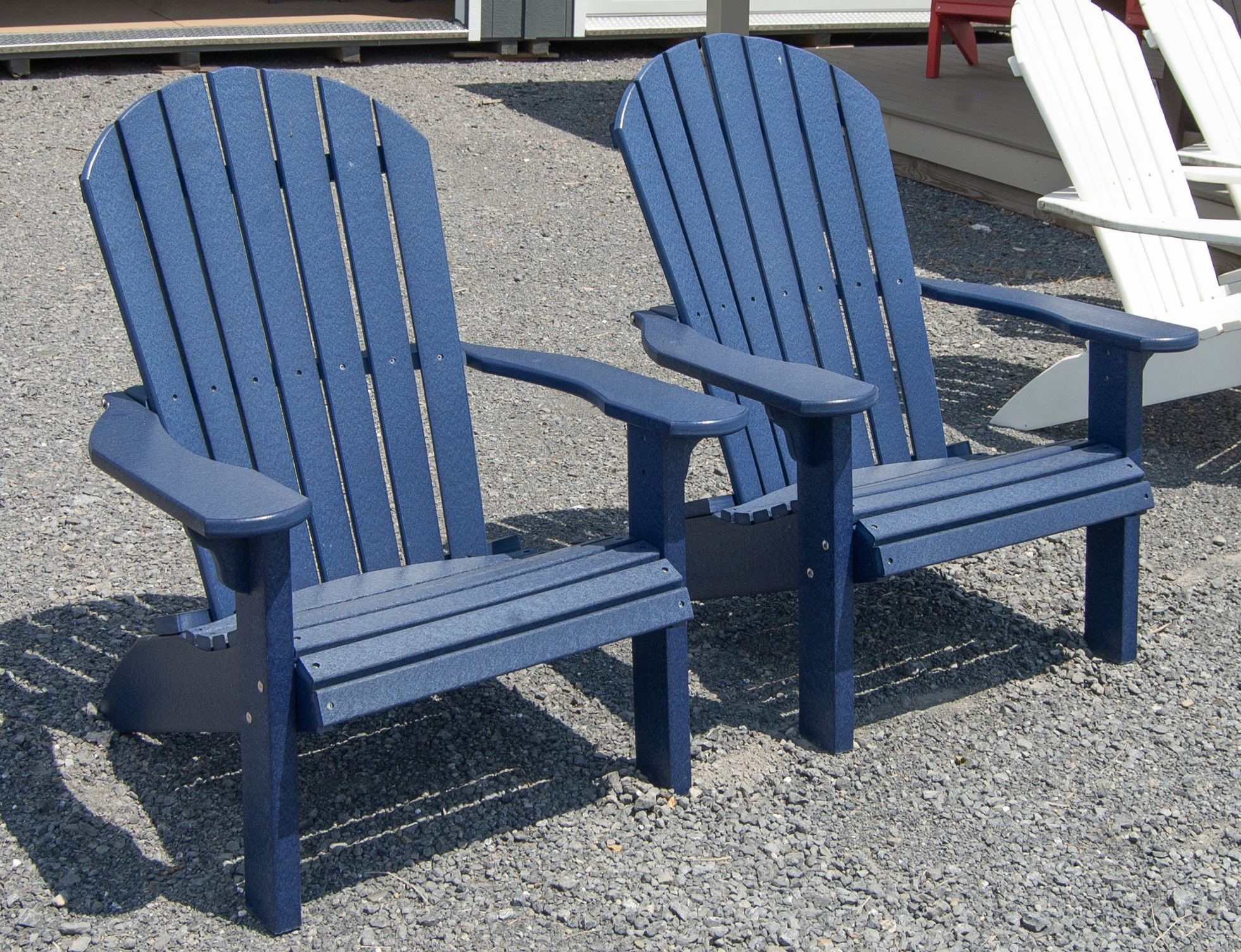 Two Patriot Blue Poly Lumber Adirondack Chairs