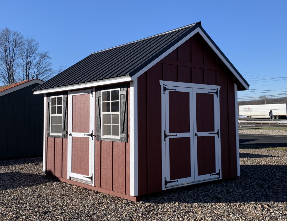Red 10x12 Cape Style Storage Shed with LP Board and Batten siding and black metal roof.