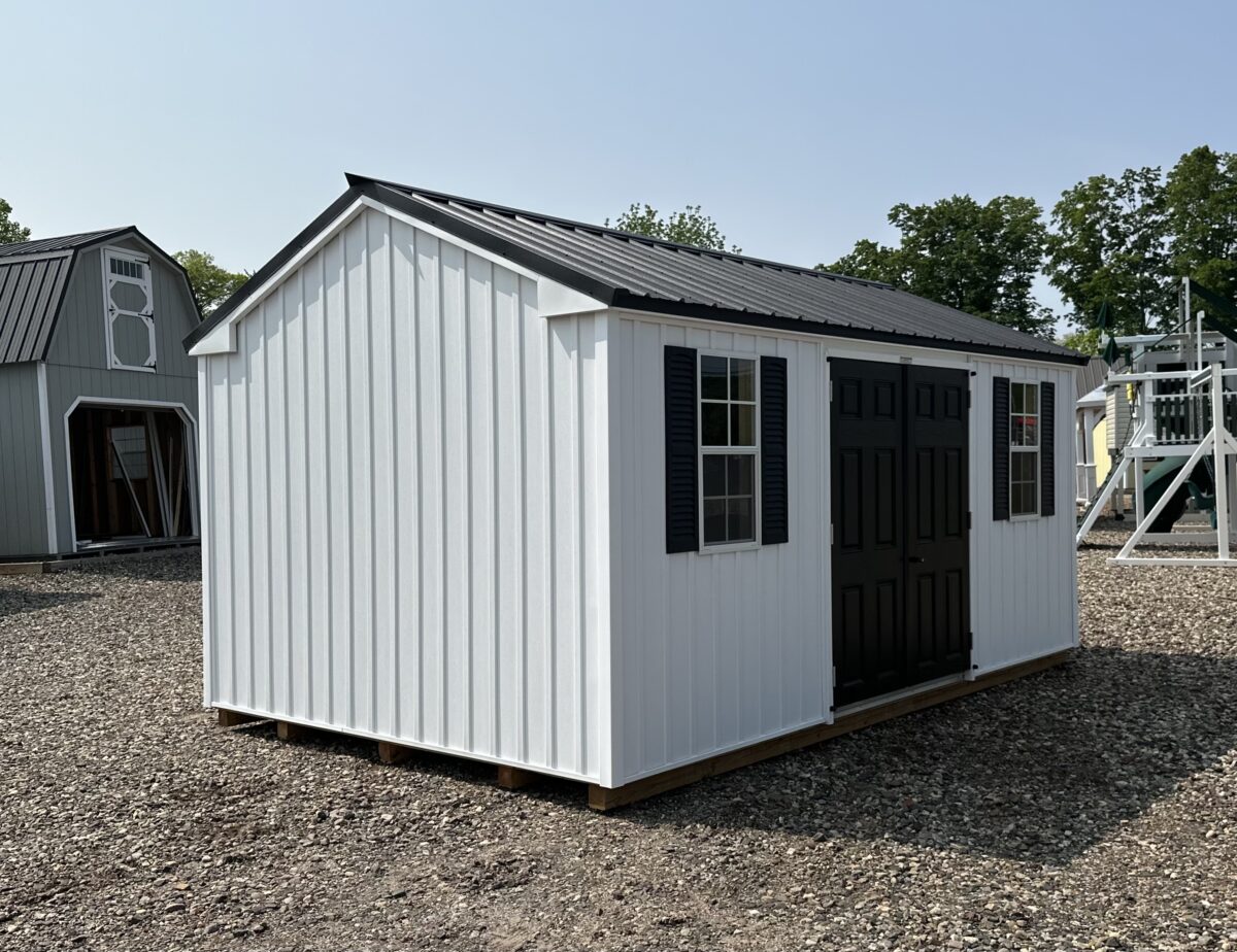 10x16 white vinyl board and batten peak shed with black metal roof and double doors.