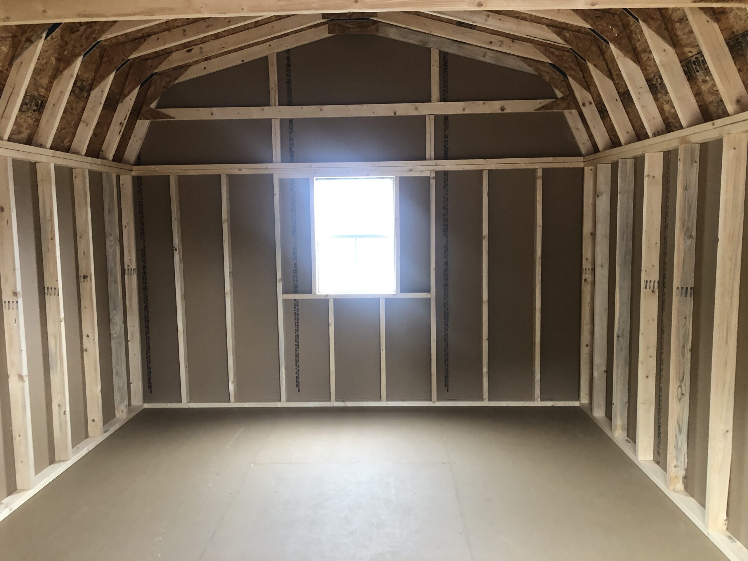 Inside of 12x16 wooden Dutch barn storage shed