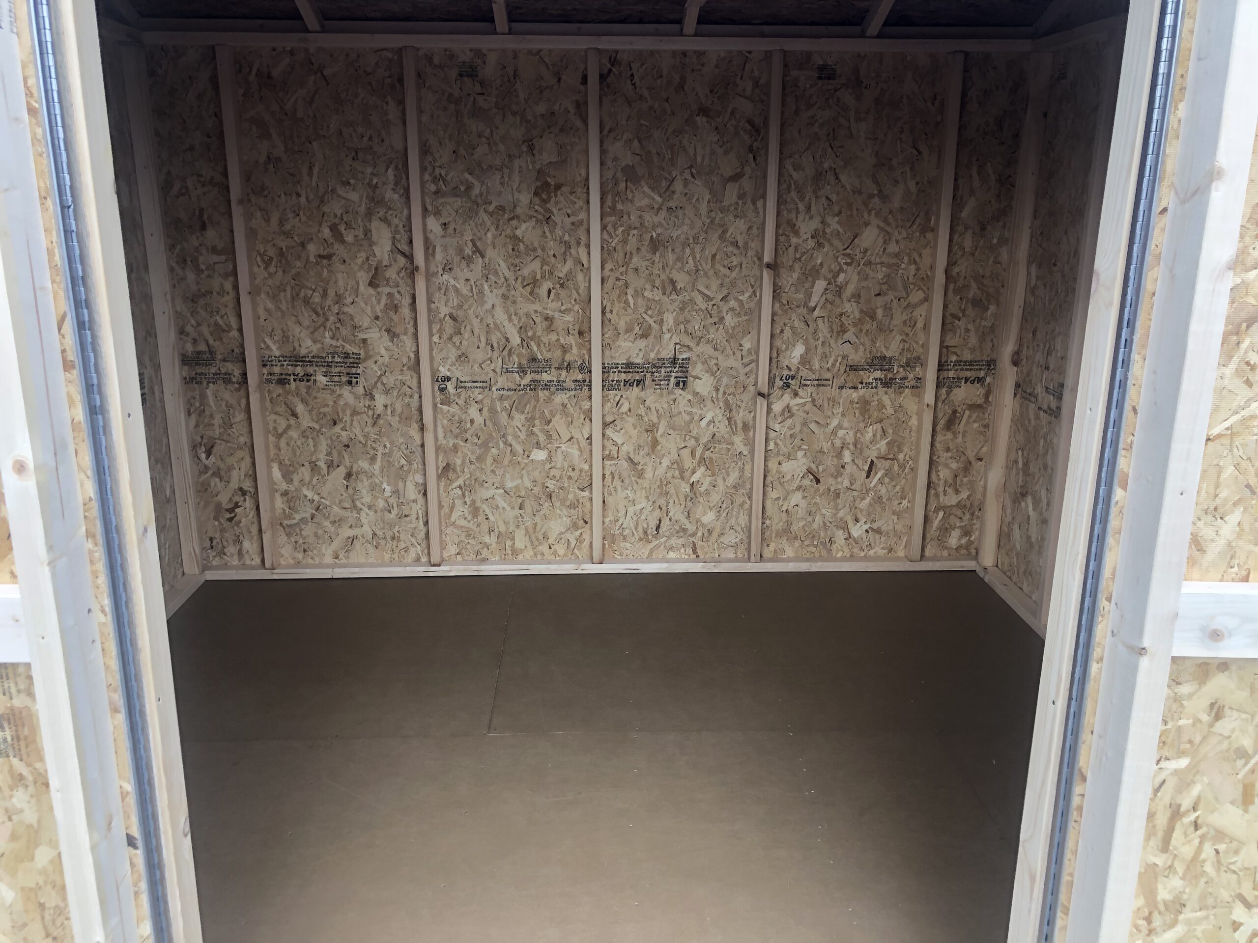 Inside of 8x12 wooden peak side storage shed