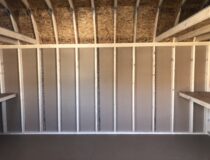 Inside of 12x16 wooden Dutch barn storage shed