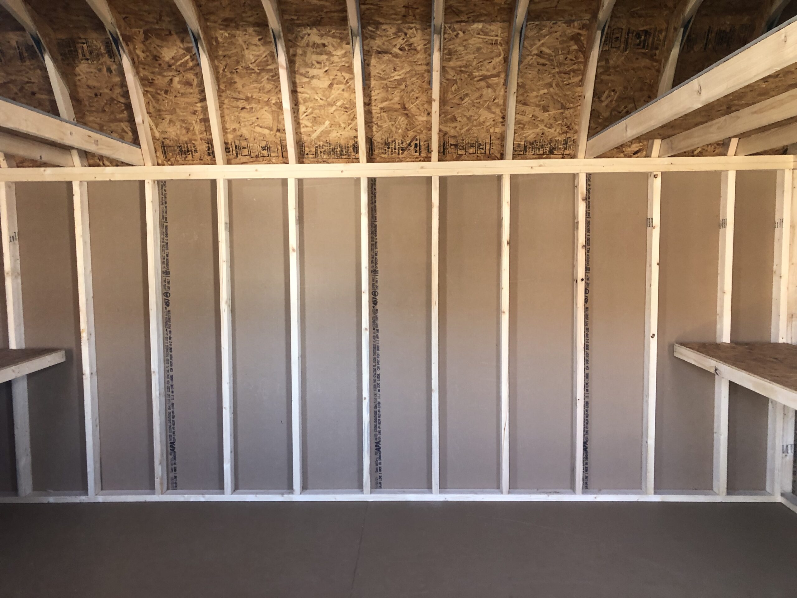 Inside of 12x16 wooden Dutch barn storage shed
