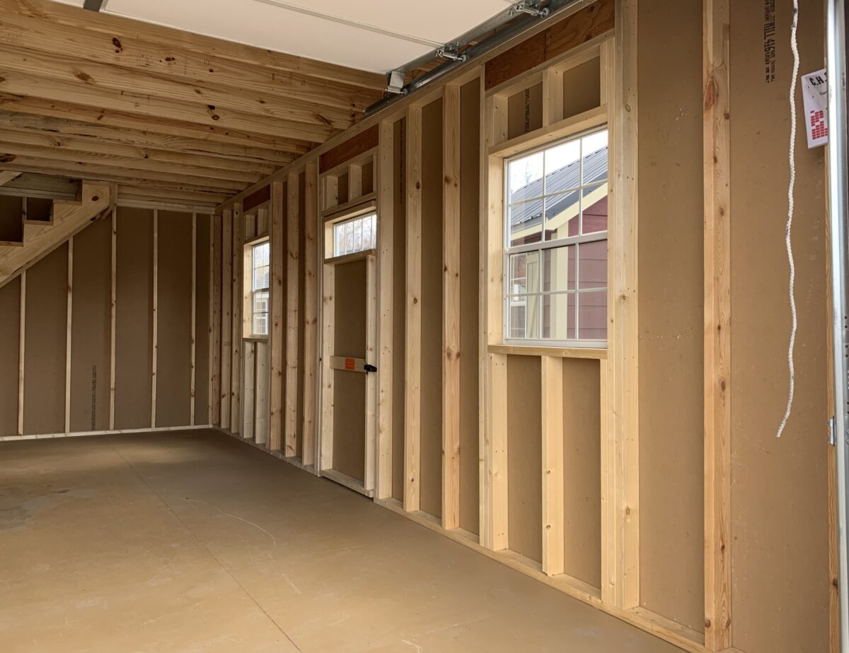 Interior of a 12x24 garage showing 8-inch on center floor joists and stairway.