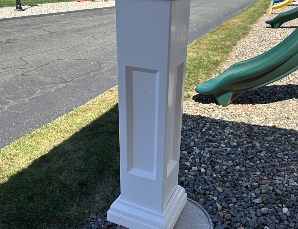 Close-up of Savannah style vinyl pavilion posts and 40-year metal roofing.