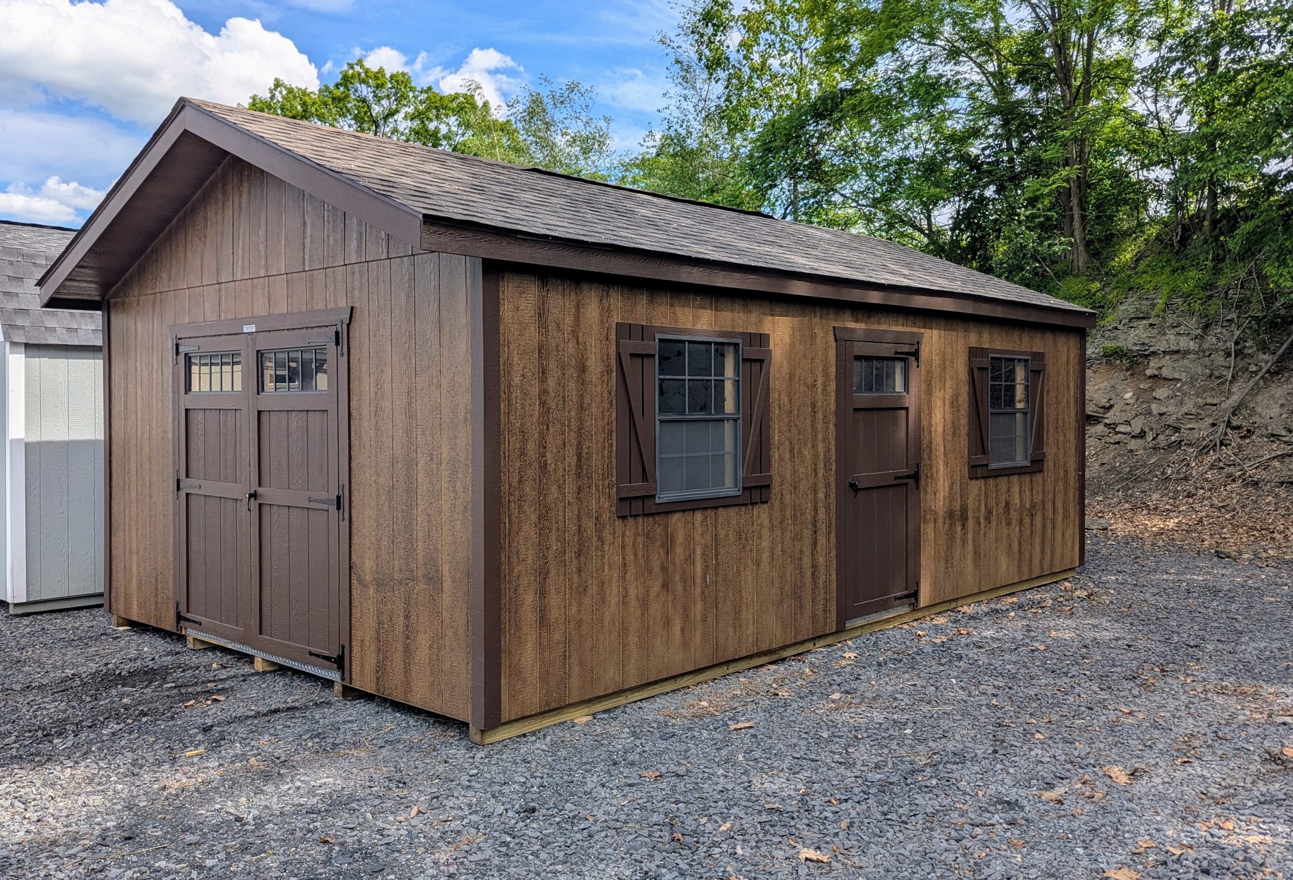 14x24 Peak Front in coffee siding and brown trim