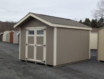 10x12 Peak Series shed in clay LP SmartSide siding with Navajo trim and transom windows in the 5' double doors