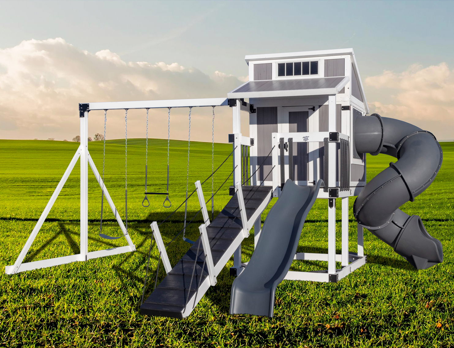 Play set with a play house that has an enclosed twisting slide and a 3 position swing beam with two swings and a trapeze.