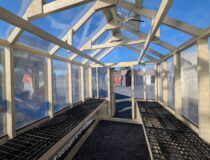 Interior of an 8x12 greenhouse with 2 sets of 3'x12' shelves