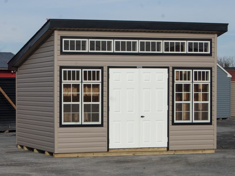 10x14 Studio Style Storage Shed with many windows and Pebble Clay vinyl siding