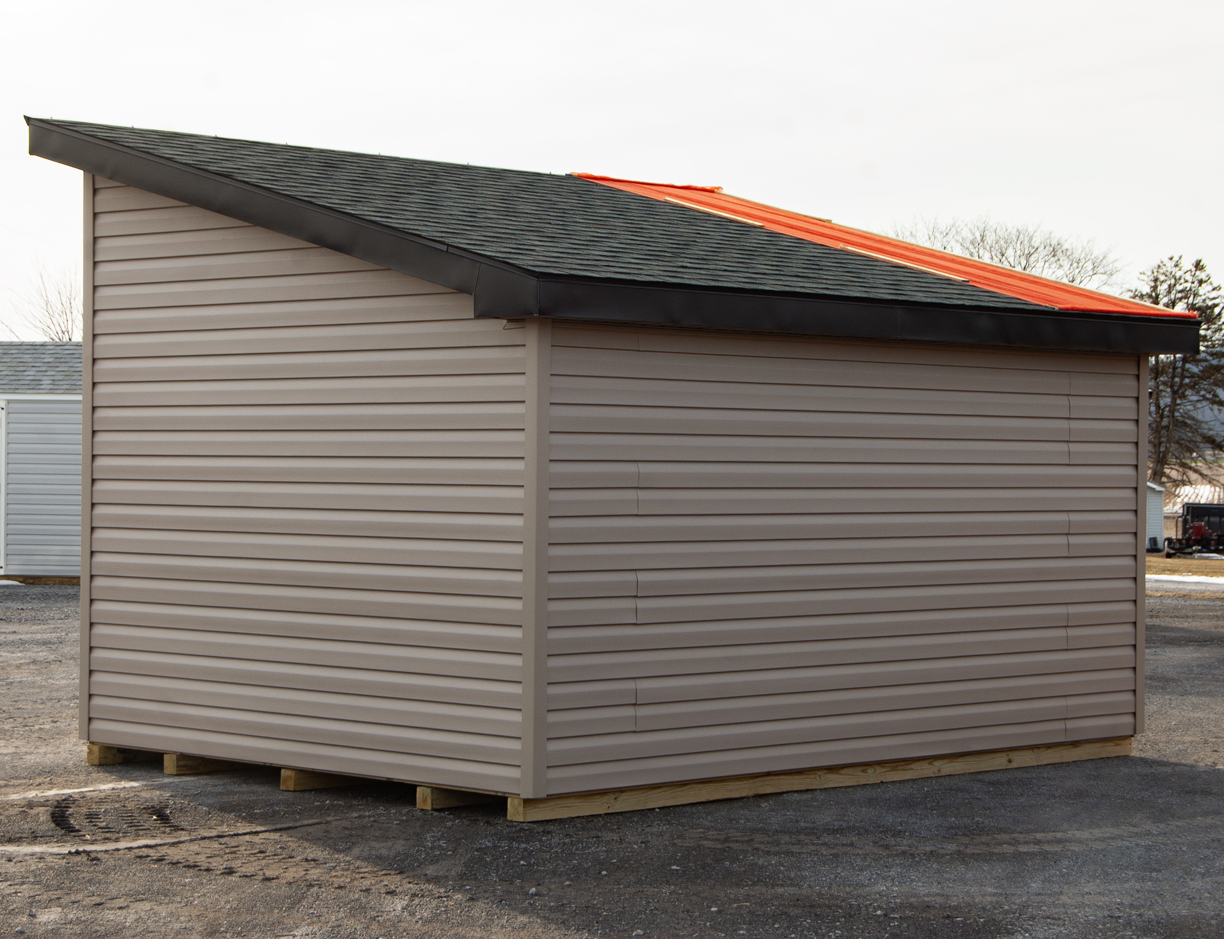 (Back) 10x14 Studio Style Storage Shed with many windows and Pebble Clay vinyl siding