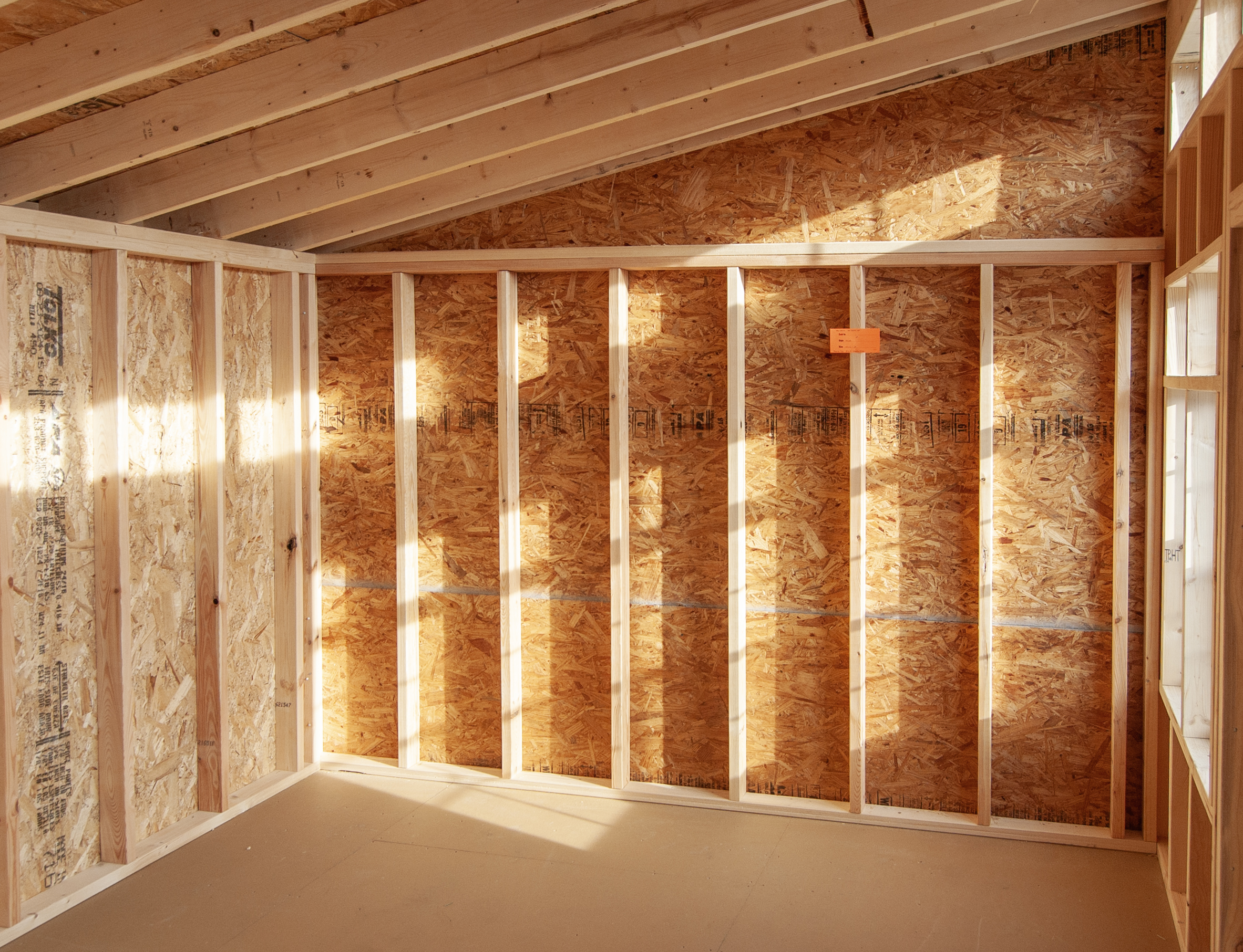 (Interior) 10x14 Studio Style Storage Shed with many windows and Pebble Clay vinyl siding