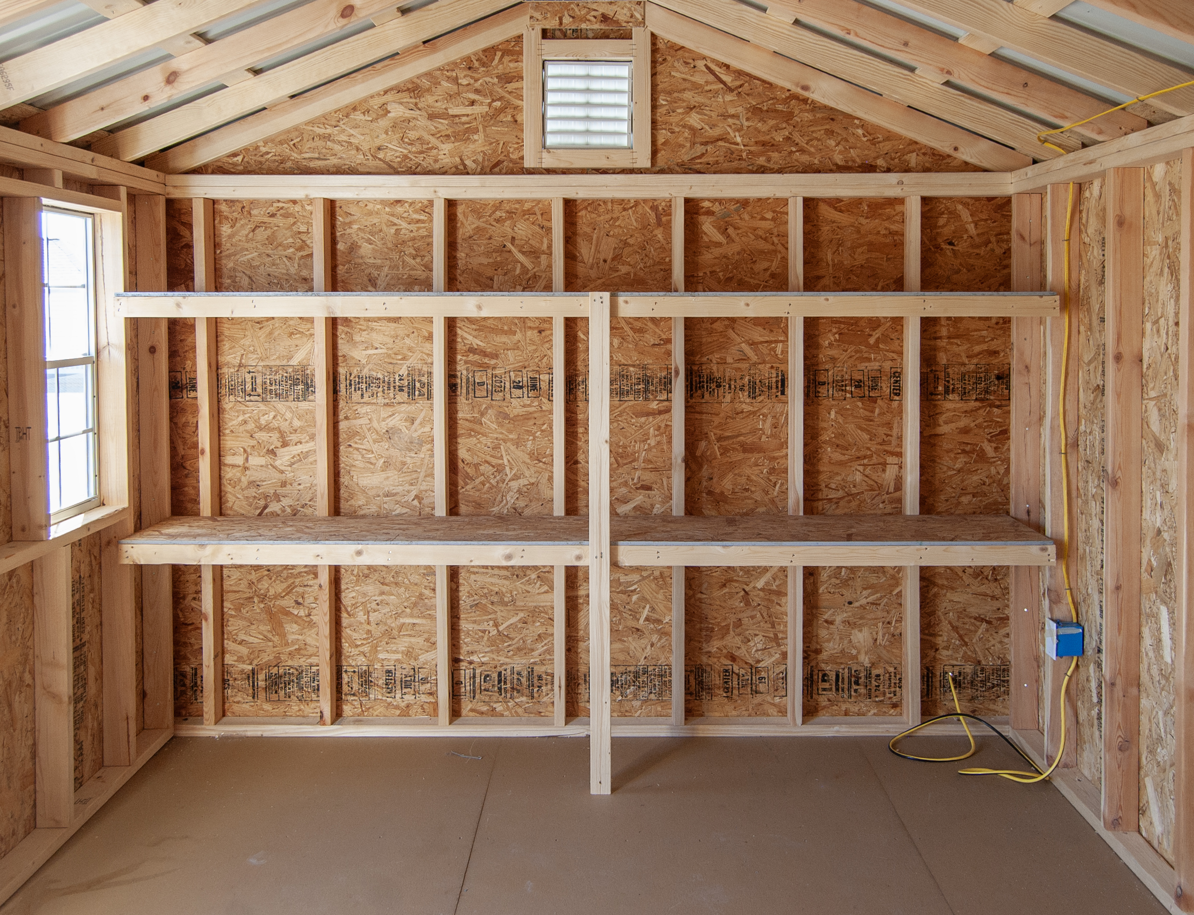 10x14 Peak Style Storage Shed Interior with Electric Package and Shelves