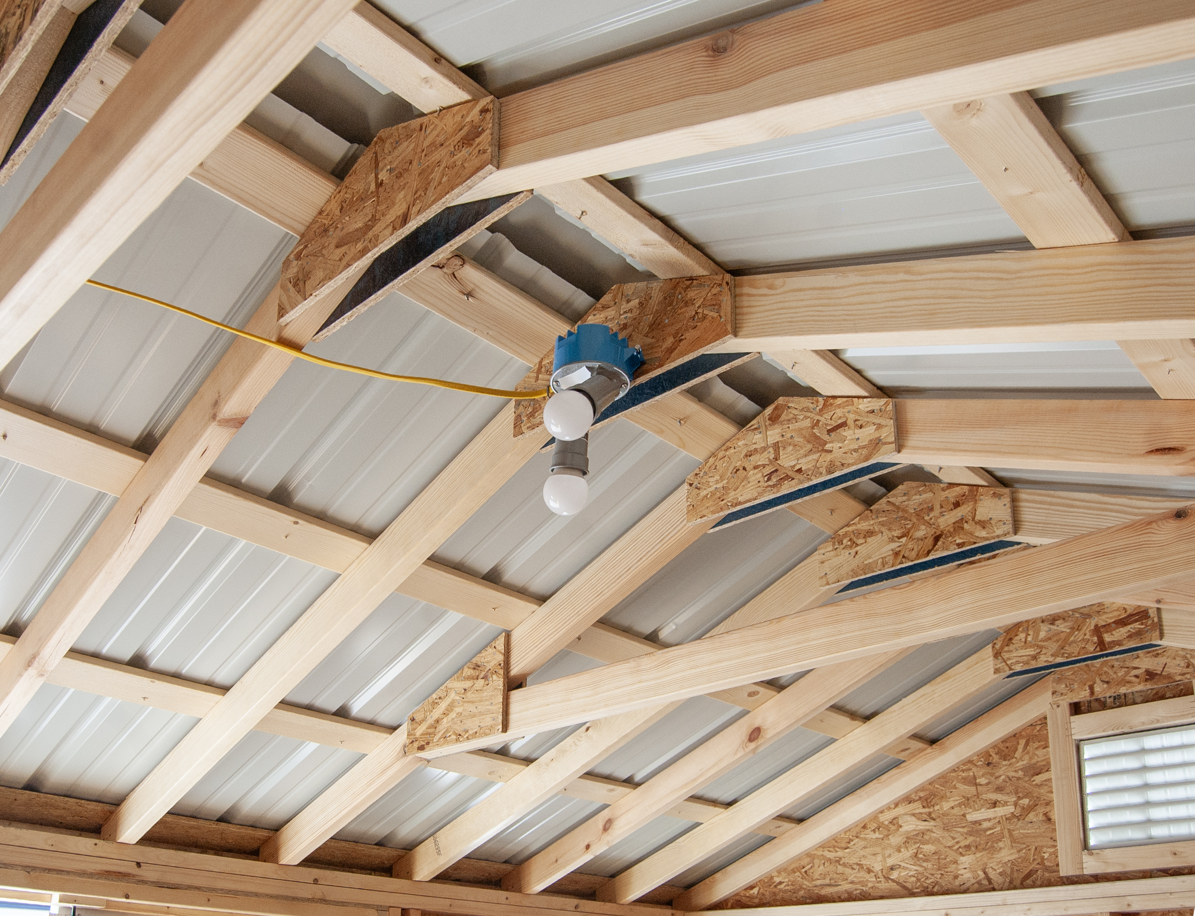 10x14 Peak Style Storage Shed Interior with Metal Roofing and Lights