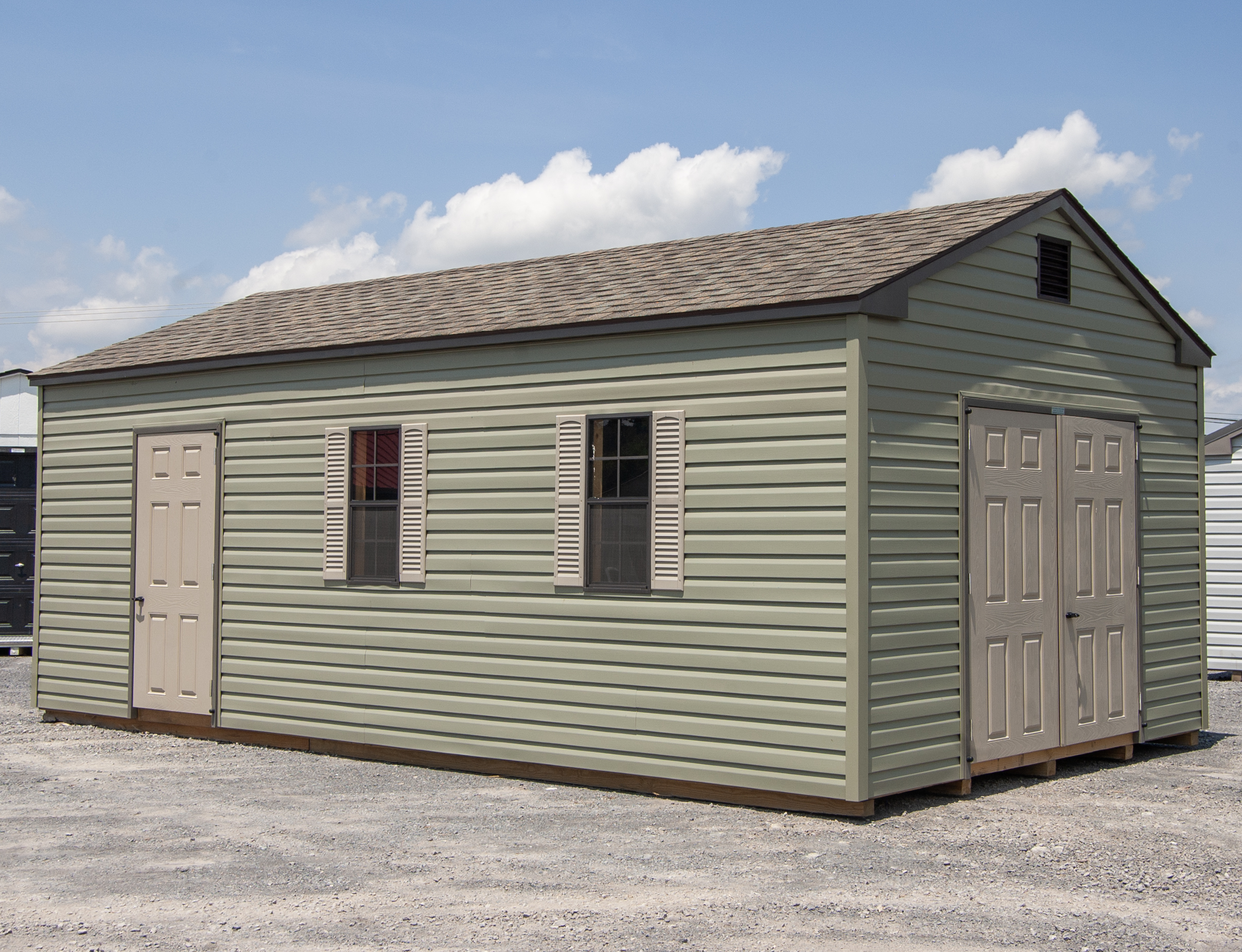 12x24 Peak Style Storage Shed with Meadow Green Vinyl sideing and clay trim