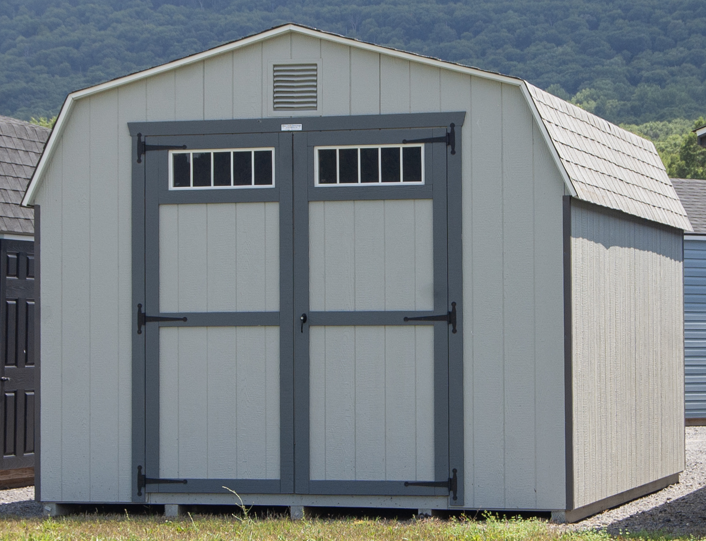 12x16 Dutch Barn Style Storage Shed with grey siding and transom windows and gable end vents