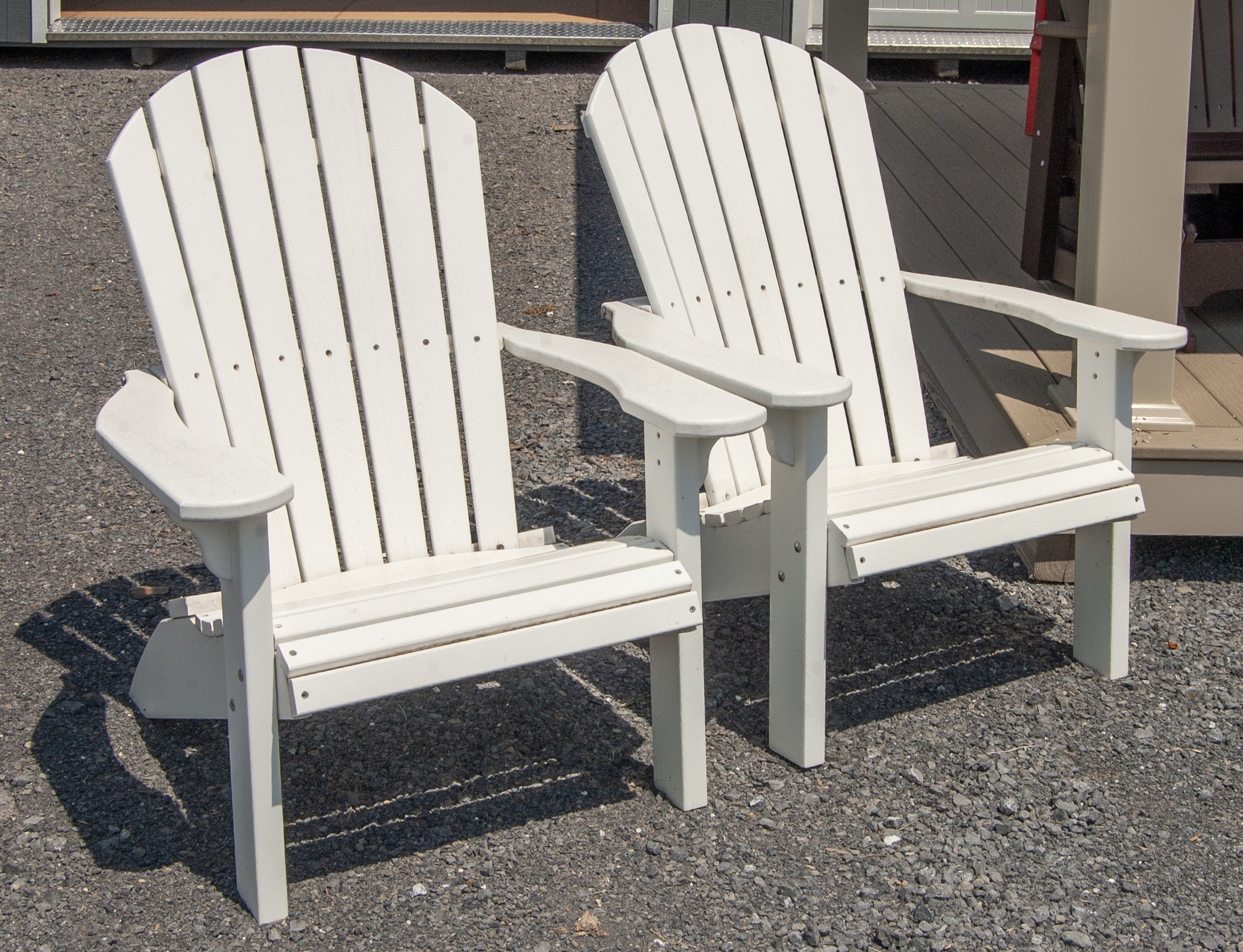 Two White Poly Lumber Adirondack Chairs