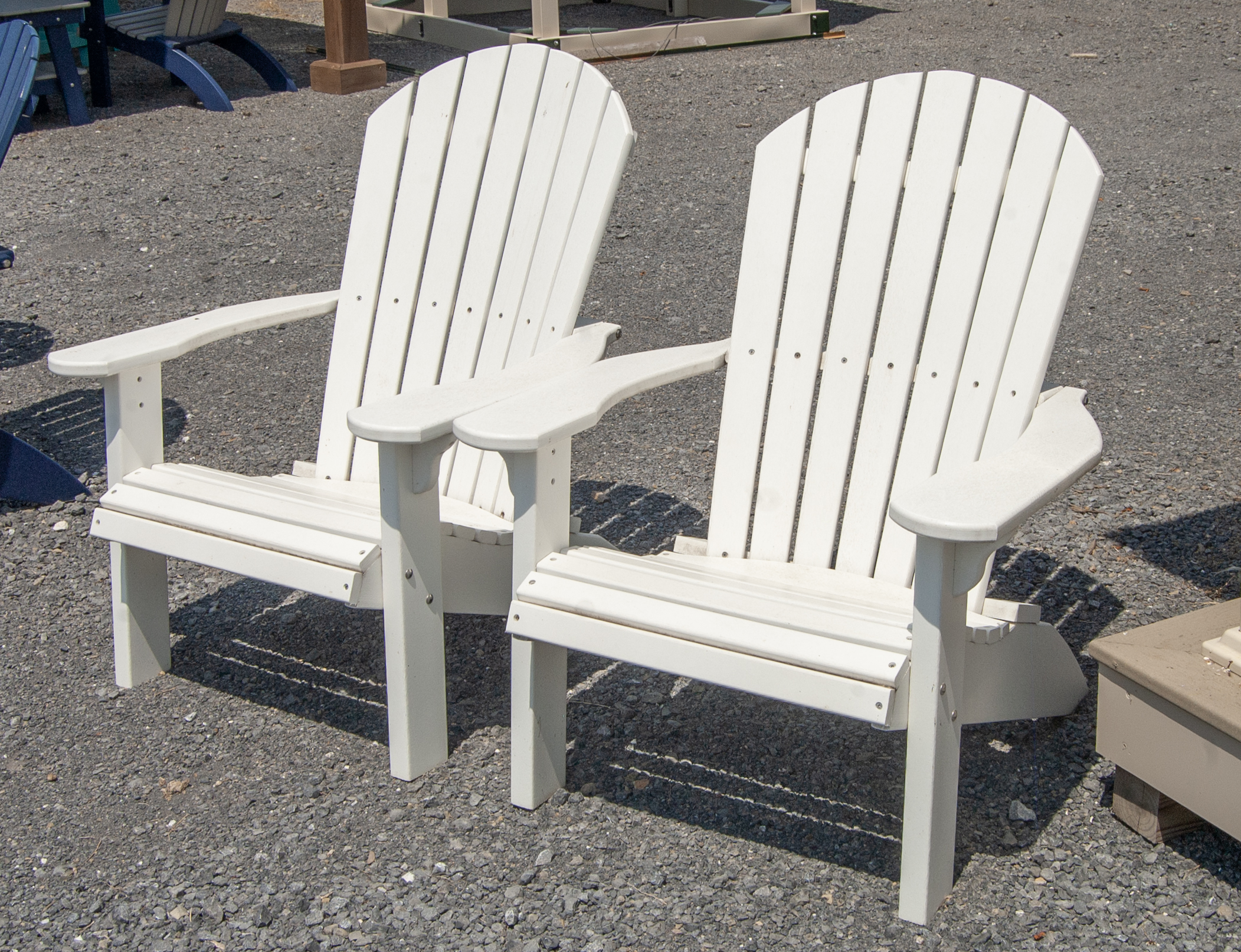 Two White Poly Lumber Adirondack Chairs