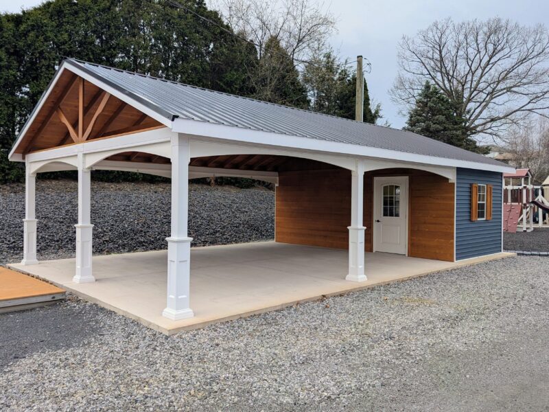 Angled view of a 20×36 Veranda Cabana showcasing the open pavilion-style front, exposed wood gable detail, and integrated enclosed room with entry door.