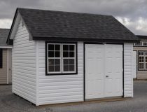 10x12 Premium Cape Cod Style Storage Shed with vinyl siding and custom shelf built inside