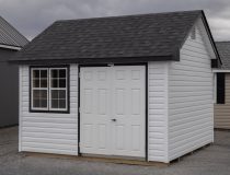 10x12 Premium Cape Cod Style Storage Shed with vinyl siding and custom shelf built inside