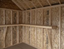 10x12 Premium Cape Cod Style Storage Shed with vinyl siding and custom shelf built inside