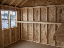 10x12 Premium Cape Cod Style Storage Shed with vinyl siding and custom shelf built inside