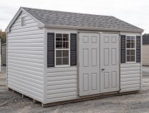 10x12 Peak Style Storage Shed With grey vinyl siding, double doors, two windows, and gable end vents