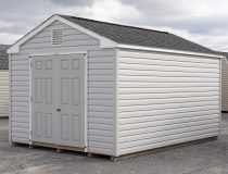 10x14 Peak Style Storage Shed With Vinyl Siding, Double Door in front, and window in back