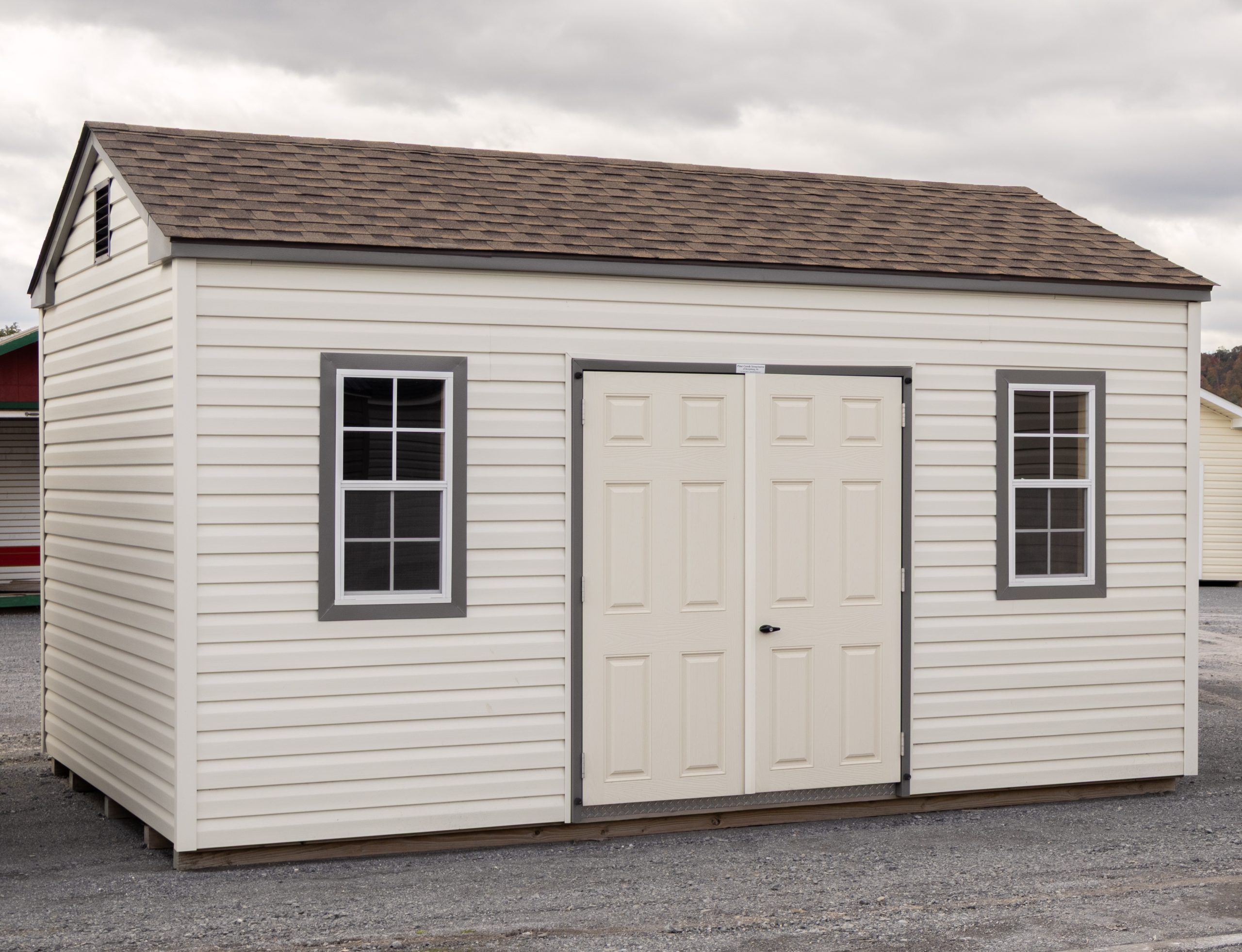 10x16 Peak Storage Shed with Classic Sand Vinyl Siding, Double Door and Two windows with trim