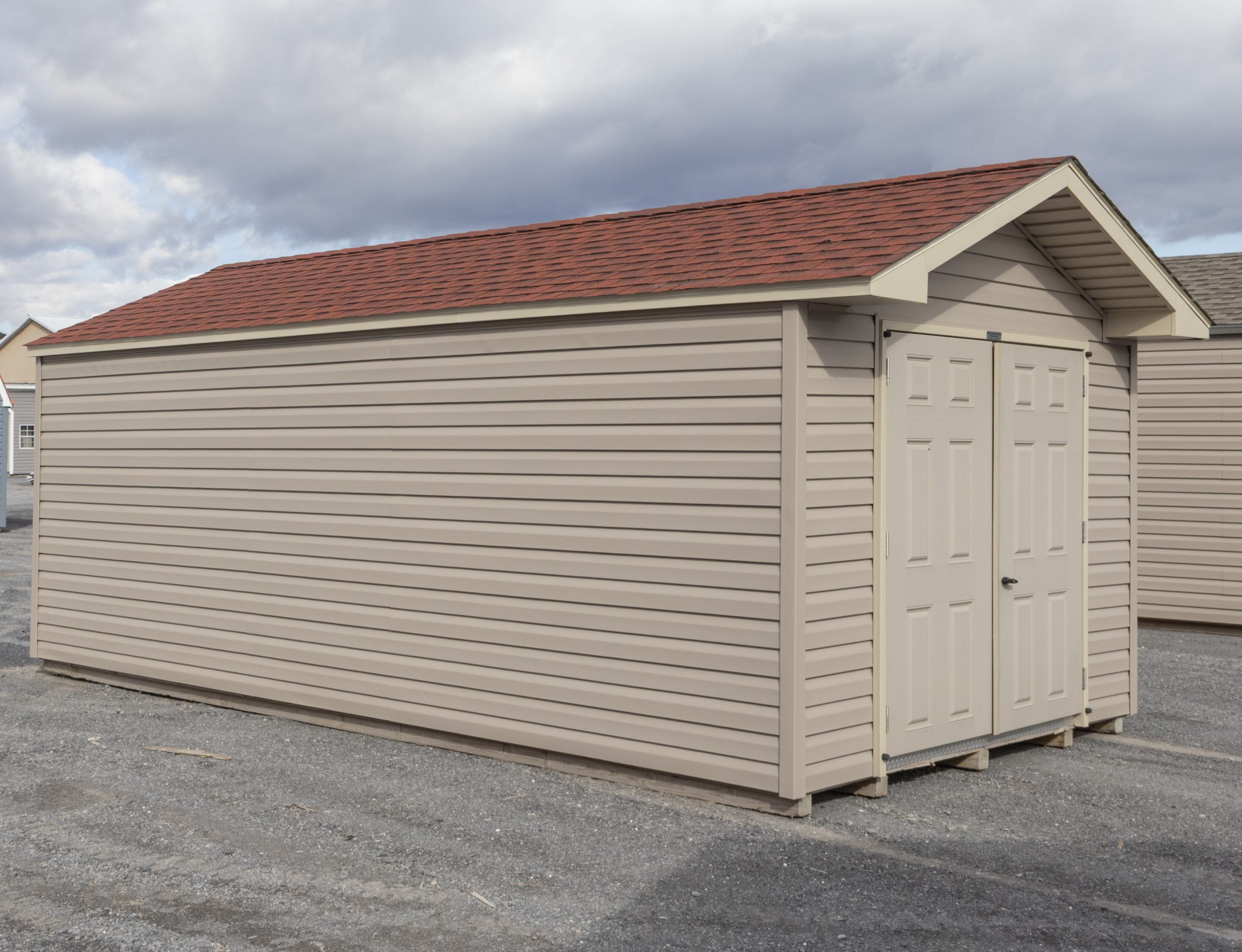 10x20 Peak Style Storage Shed with Clay Vinyl Siding and Red Shingles