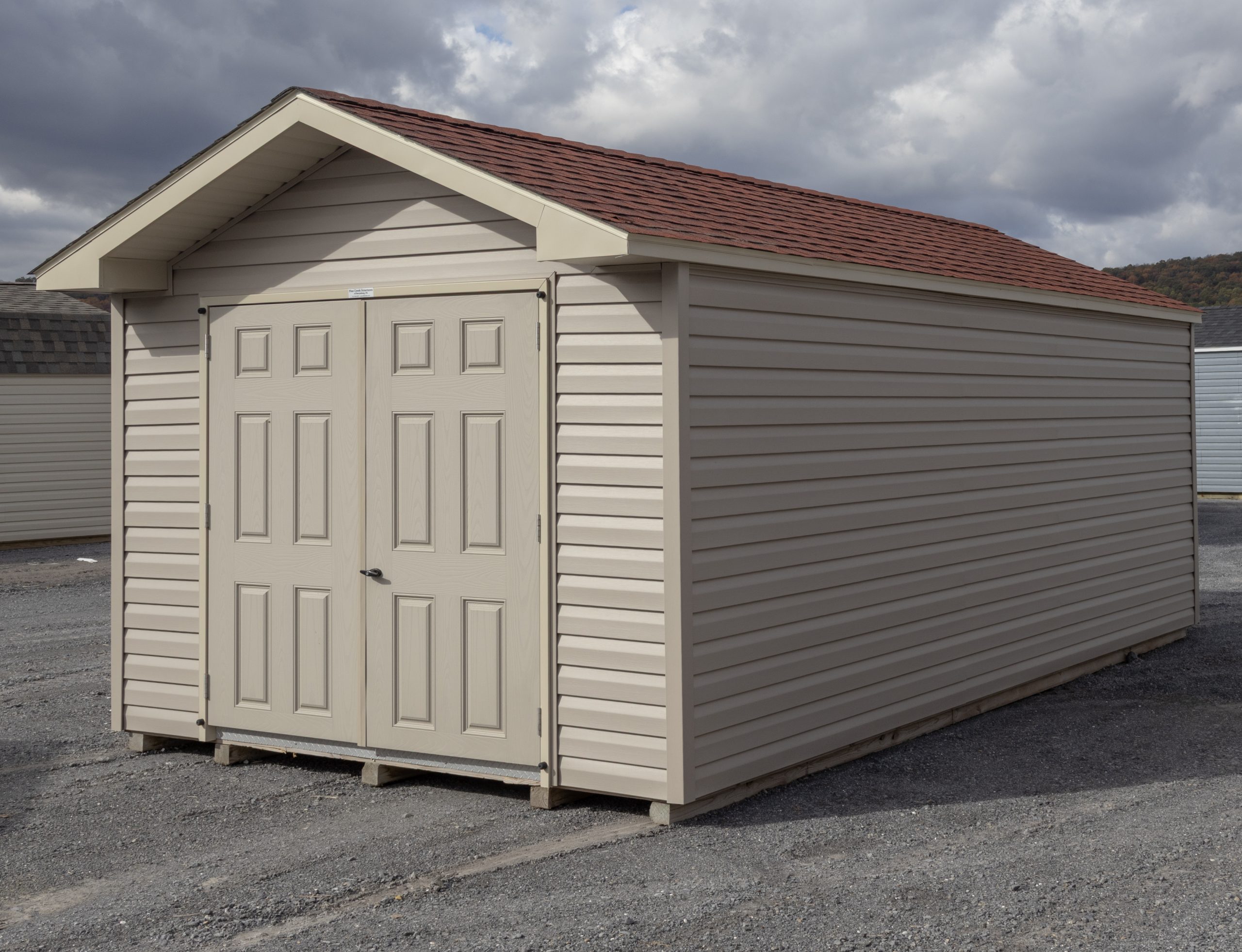 10x20 Peak Style Storage Shed with Clay Vinyl Siding and Red Shingles