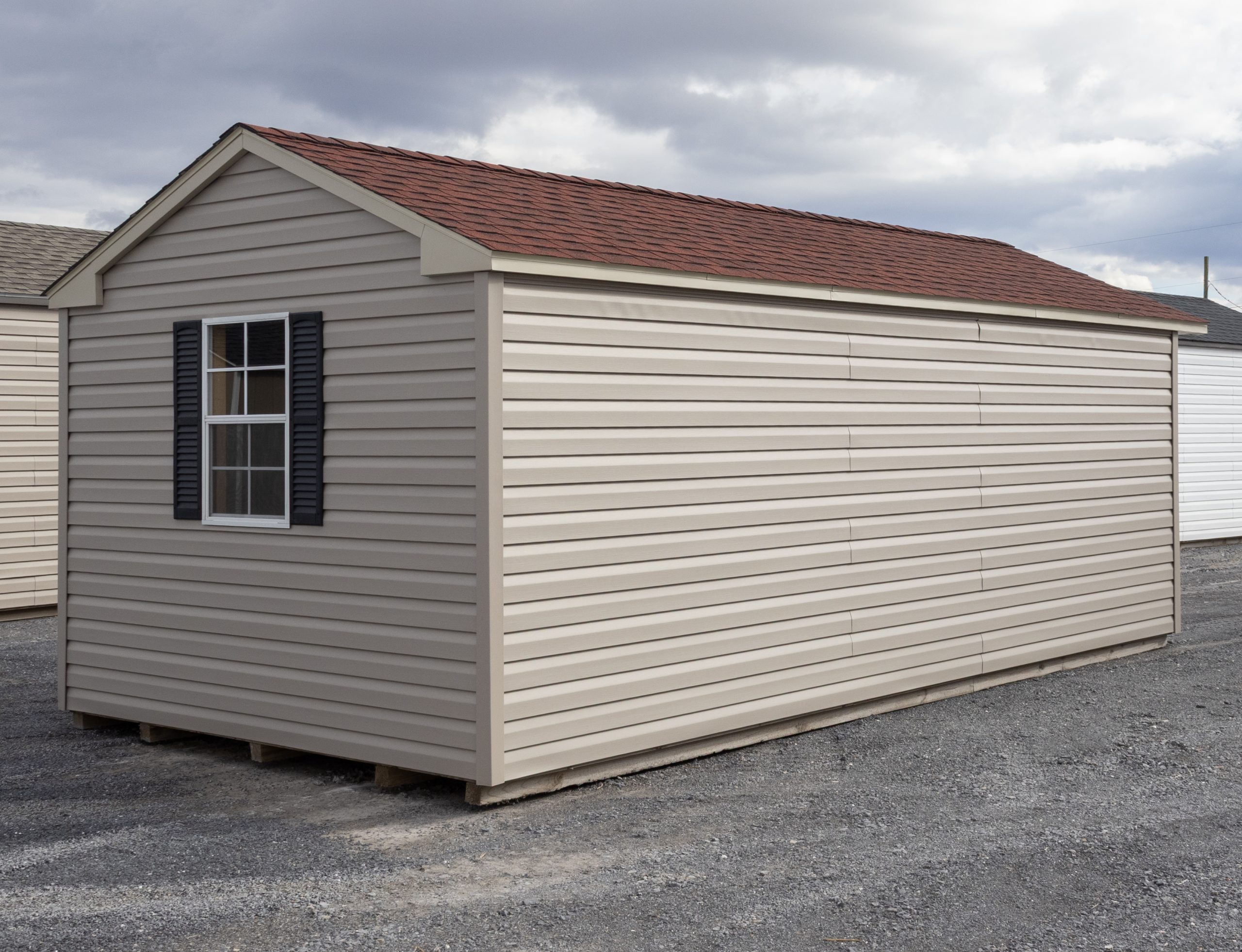 10x20 Peak Style Storage Shed with Clay Vinyl Siding and Red Shingles