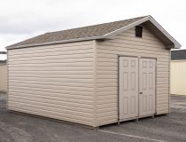 12x16 Front Entry Peak Shed with Vinyl Siding, double doors, a window in the back, and gable end vents