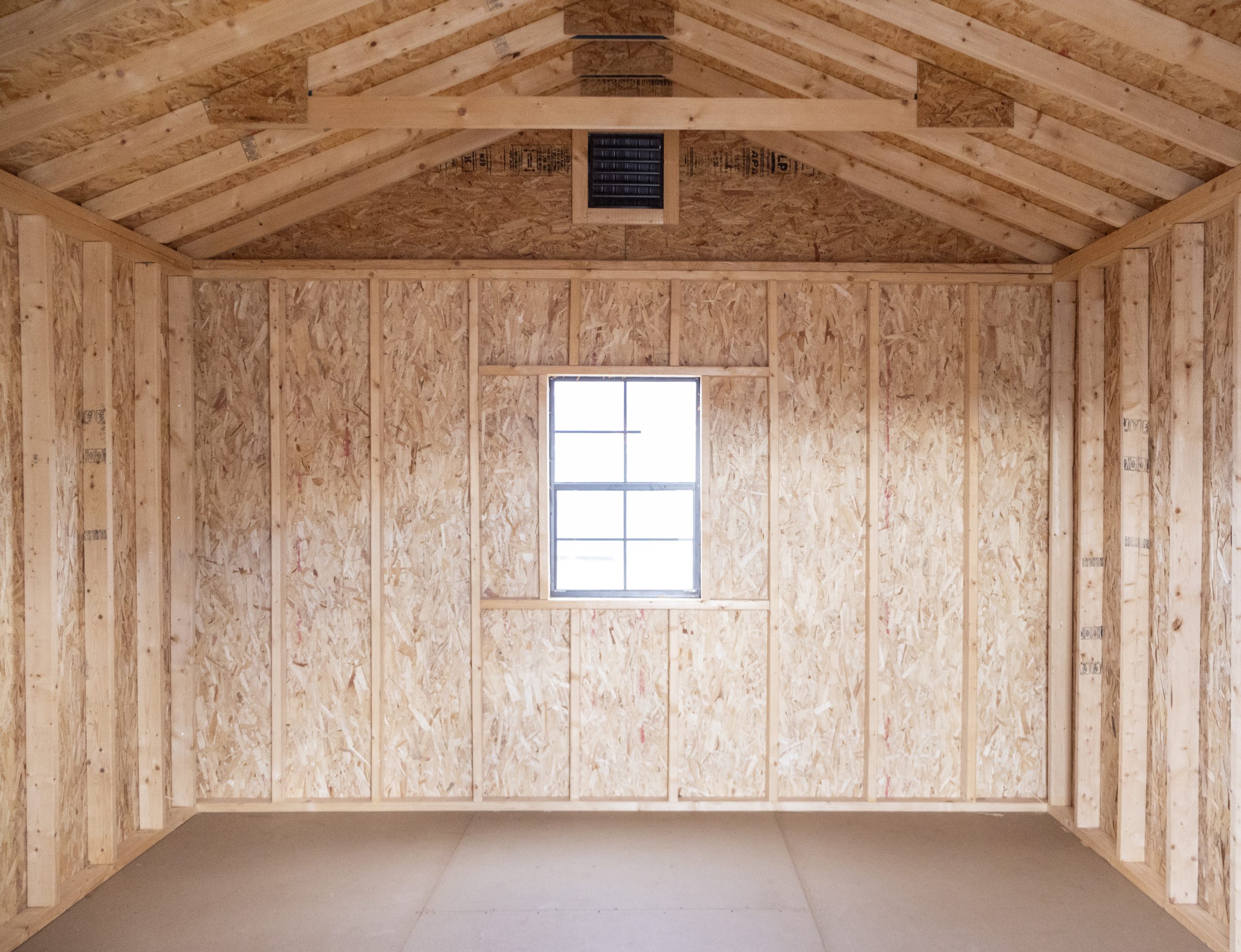 12x16 Front Entry Peak Shed with Vinyl Siding, double doors, a window in the back, and gable end vents (Interior View)