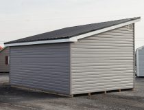 12x16 Studio Style Storage Shed with many windows and graphite grey vinyl siding and metal roof