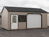 12x20 Custom Vinyl Peak Storage Shed with Overhead garage door and Workbench built inside