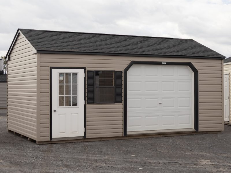 12x20 Custom Vinyl Peak Storage Shed with Overhead garage door and Workbench built inside
