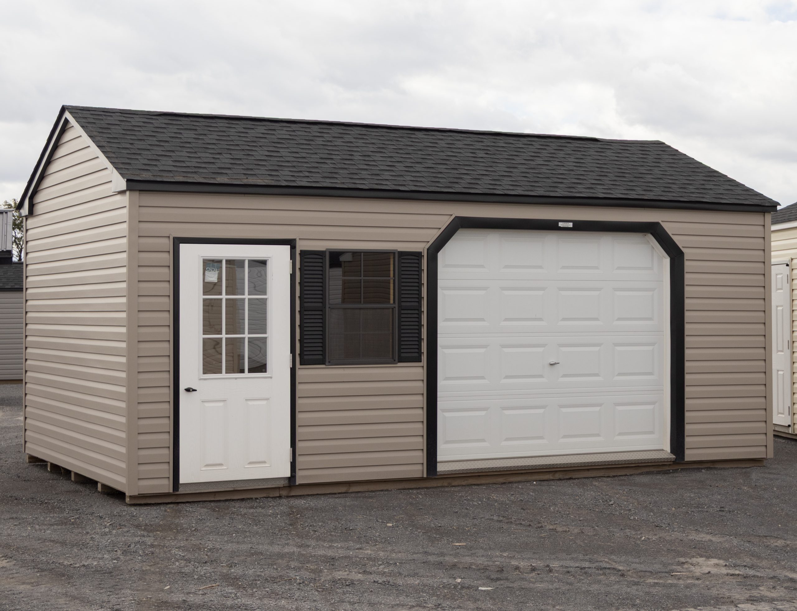 12x20 Custom Vinyl Peak Storage Shed with Overhead garage door and Workbench built inside