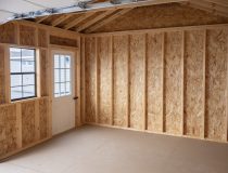 12x20 Custom Vinyl Peak Storage Shed with Overhead garage door and Workbench built inside