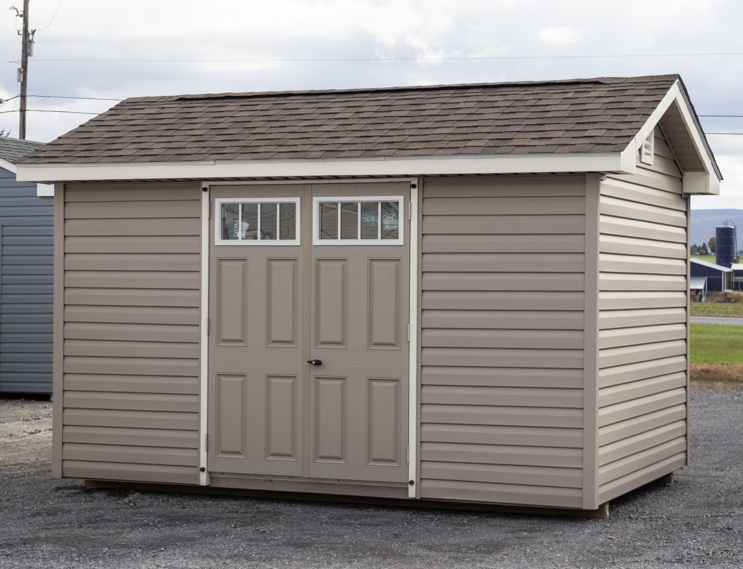 8x12 Custom Peak Style Storage Shed with Vinyl Siding, larger roof overhangs, and gable end vents