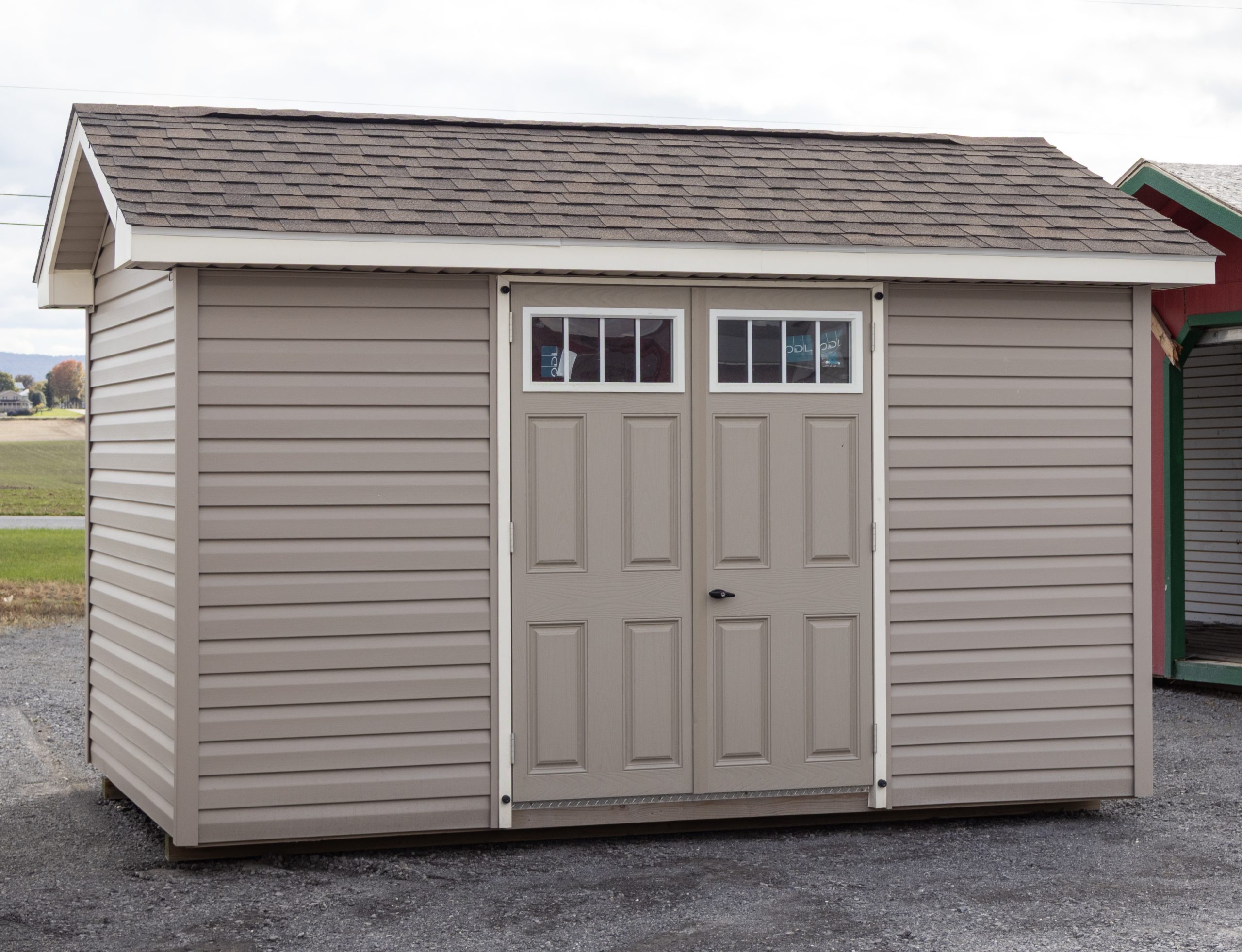 8x12 Custom Peak Style Storage Shed with Vinyl Siding, larger roof overhangs, and gable end vents
