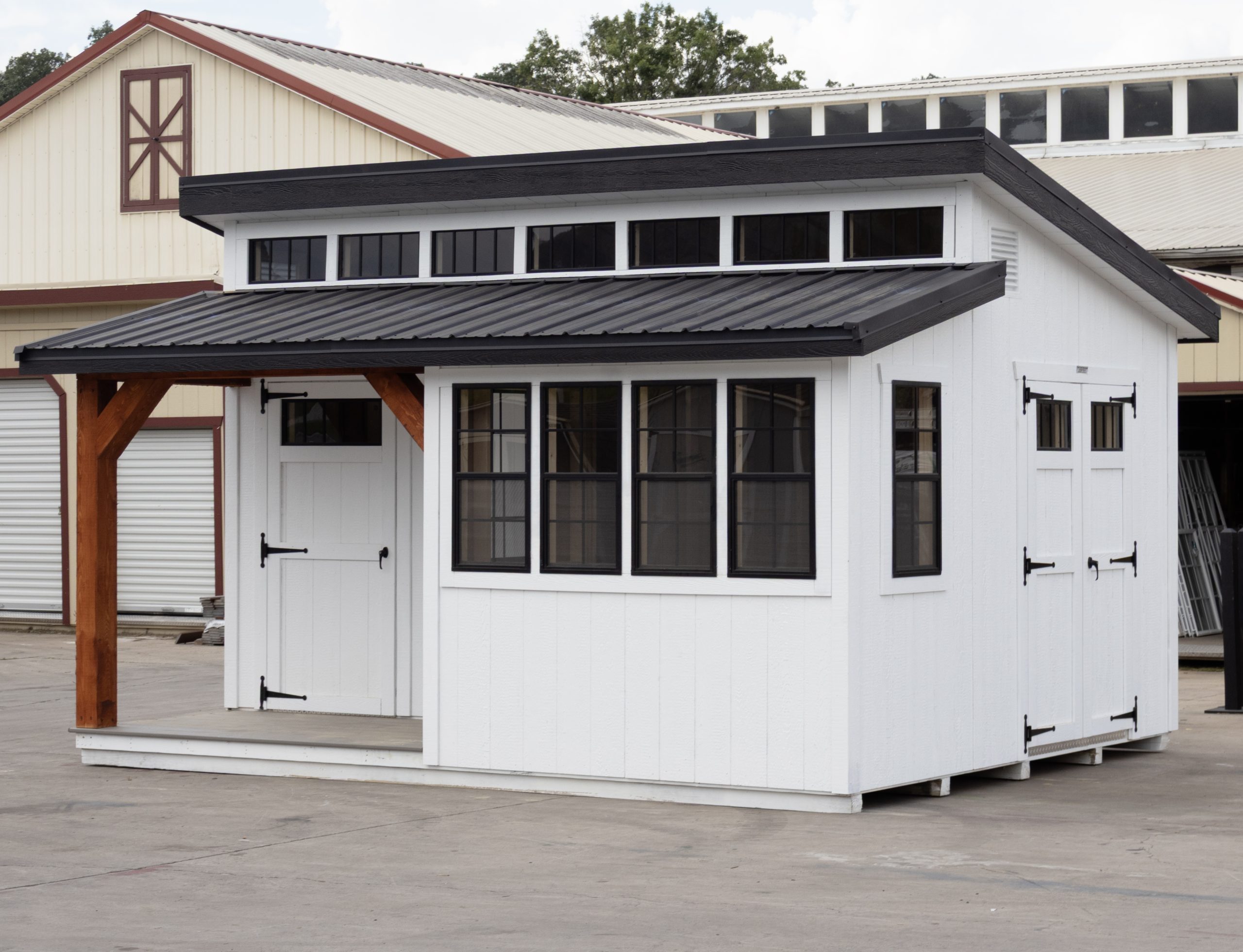 12x16 Custom Studio Style Storage Shed With Hemlock Porch and Workbench inside