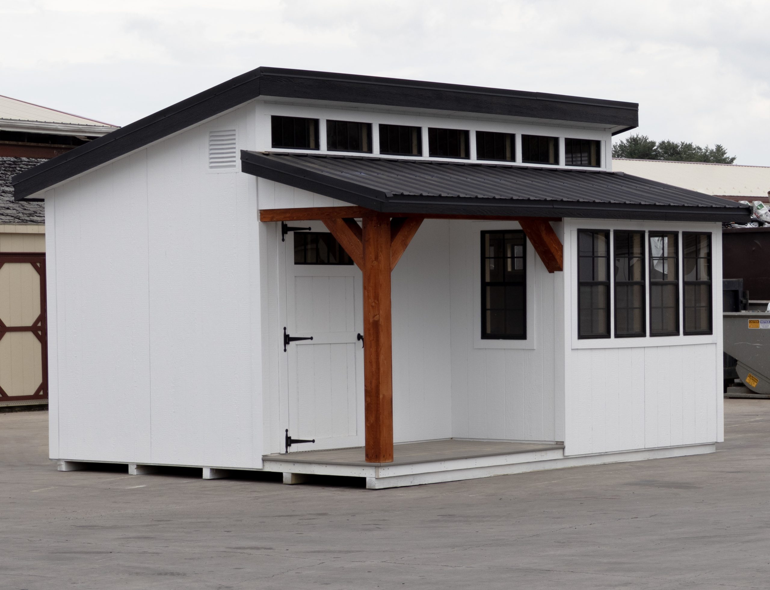 12x16 Custom Studio Style Storage Shed With Hemlock Porch and Workbench inside