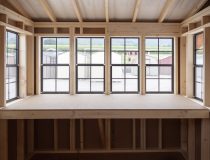 12x16 Custom Studio Style Storage Shed With Hemlock Porch and Workbench inside